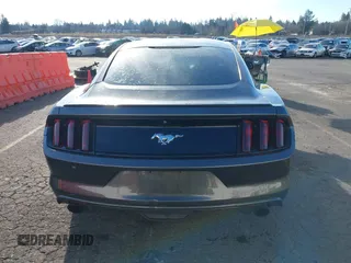 2015 Ford Mustang EcoBoost z VIN 1FA6P8TH7F5351477, wystawiony jako IAAI lot #41378347 z przebiegiem 104 755 mil mil oraz . Historia ofert i sprzedaży dostępna na DreamBid. Obrazek 16.