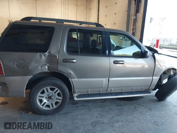 2005 Mercury Mountaineer z VIN 4M2ZU86E85ZJ14273, wystawiony jako IAAI lot #41296699 z przebiegiem 109 719 mil mil oraz . Historia ofert i sprzedaży dostępna na DreamBid. Obrazek 13.