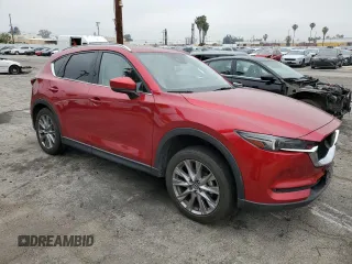 2020 Mazda CX-5 Grand Touring with VIN JM3KFADM1L1837775, listed as a Copart auction lot 55314595 with 82,359 mi miles and Clean Title. Bid and sale history available at DreamBid. Image 4.