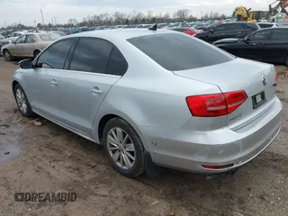 2015 Volkswagen Jetta Sedan 1.8T SE with VIN 3VWD17AJ4FM302117, listed as a IAAI auction lot 41917138 with 122,946 mi miles. Bid and sale history available at carsss.com. Image 3.