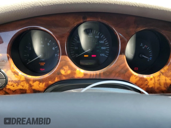 1999 Jaguar XJ with VIN SAJHX604XXC854217, listed as a Copart auction lot 56042735 with 127,092 mi miles and Salvage title. Bid and sale history available at DreamBid. Image 9.