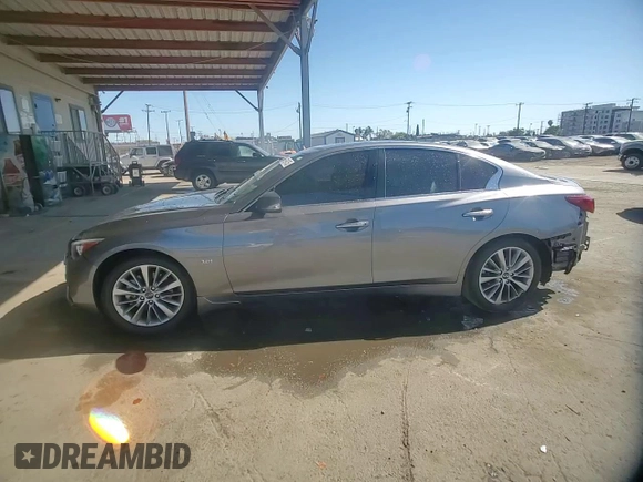 2019 Infiniti Q50 Luxe z VIN JN1EV7AP4KM514928, wystawiony jako Copart lot #56694755 z przebiegiem 63 705 mil mil oraz Szkoda całkowita • Salvage title. Historia ofert i sprzedaży dostępna na DreamBid. Obrazek 14.