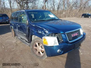 2004 GMC Envoy SLE with VIN 1GKDS13S842152119, listed as a IAAI auction lot 41187115 with 194,304 mi miles. Bid and sale history available at carsss.com. Image 1.