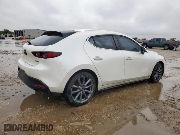 2019 Mazda 3 with VIN JM1BPBJM2K1136404, listed as a Copart auction lot 60378665 with 61,903 mi miles and Salvage title. Bid and sale history available at DreamBid. Image 3.