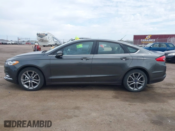 2017 Ford Fusion SE z VIN 3FA6P0H76HR354078, wystawiony jako IAAI lot #42103550 z przebiegiem 103 201 mil mil oraz . Historia ofert i sprzedaży dostępna na DreamBid. Obrazek 14.