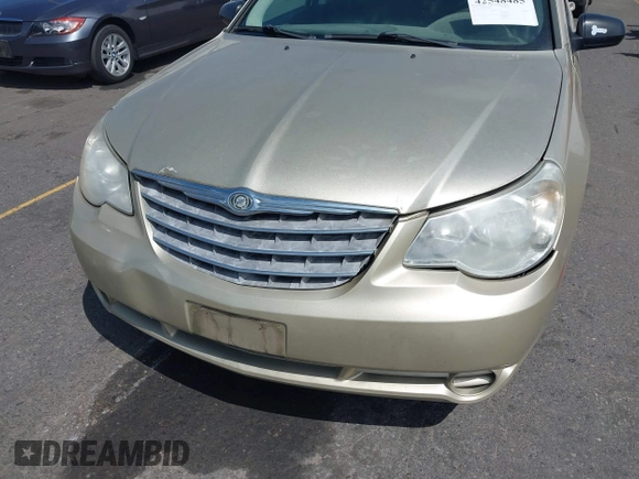 2010 Chrysler Sebring Touring z VIN 1C3CC4FBXAN144734, wystawiony jako IAAI lot #42548485 z przebiegiem 160 588 mil mil oraz . Historia ofert i sprzedaży dostępna na DreamBid. Obrazek 6.