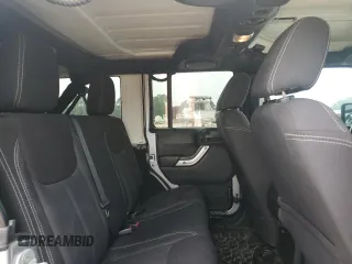 2013 Jeep Wrangler Unlimited Rubicon with VIN 1C4BJWFG5DL661282, listed as a Copart auction lot 57471035 with 128,400 mi miles and Salvage title. Bid and sale history available at DreamBid. Image 11.