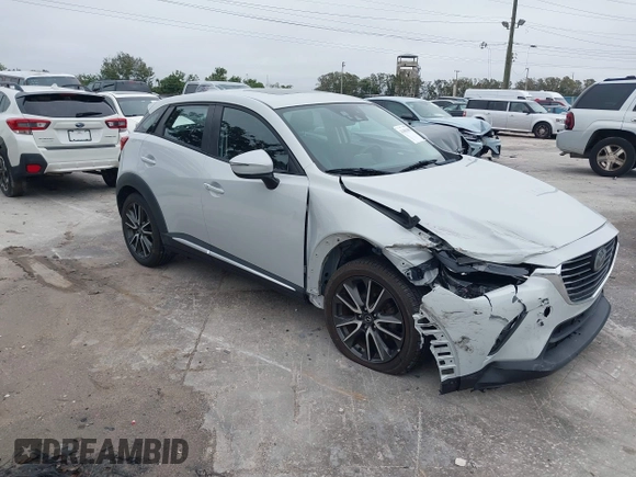 2016 Mazda CX-3 Grand Touring with VIN JM1DKDD72G0128891, listed as a IAAI auction lot 41401456 with 60,911 mi miles. Bid and sale history available at carsss.com. Image 1.