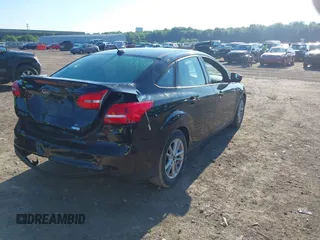 2018 Ford Focus SE with VIN 1FADP3FEXJL286396, listed as a IAAI auction lot 42634912 with 73,769 mi miles and . Bid and sale history available at DreamBid. Image 4.