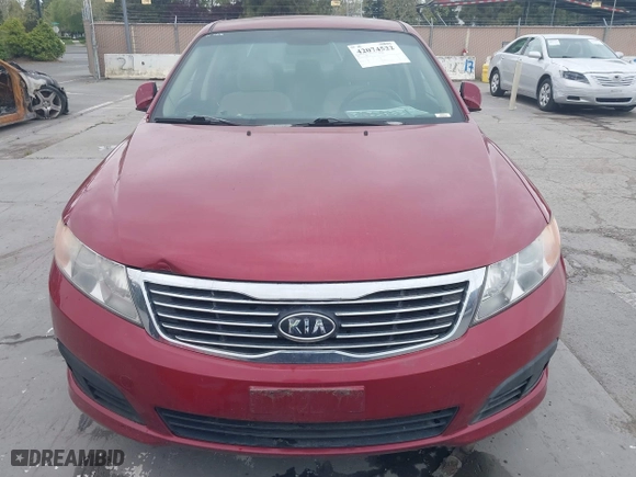 2009 Kia Optima LX with VIN KNAGE228095312766, listed as a IAAI auction lot 42074522 with 183,240 mi miles. Bid and sale history available at carsss.com. Image 6.