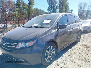 2014 Honda Odyssey Touring with VIN 5FNRL5H92EB016546, listed as a IAAI auction lot 41689148 with 143,601 mi miles and . Bid and sale history available at DreamBid. Image 2.