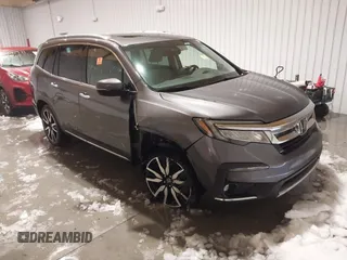 2021 Honda Pilot Touring 8-Passenger z VIN 5FNYF6H99MB028751, wystawiony jako IAAI lot #41226814 z przebiegiem Nie podano mil oraz . Historia ofert i sprzedaży dostępna na DreamBid. Obrazek 1.