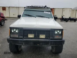 1989 Jeep Cherokee z VIN 1J4FT28LXKL601505, wystawiony jako Copart lot #49312265 z przebiegiem 264 769 mil mil oraz Szkoda całkowita • Salvage title. Historia ofert i sprzedaży dostępna na DreamBid. Obrazek 5.