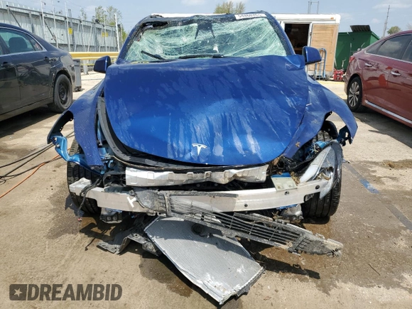 2022 Tesla Model Y Long Range z VIN 7SAYGDEE8NF447410, wystawiony jako Copart lot #54860765 z przebiegiem Nie podano mil oraz Szkody całkowita. Historia ofert i sprzedaży dostępna na DreamBid. Obrazek 5.