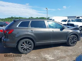 2015 Mazda CX-9 Grand Touring z VIN JM3TB3DV8F0465155, wystawiony jako IAAI lot #42366636 z przebiegiem 125 407 mil mil oraz . Historia ofert i sprzedaży dostępna na DreamBid. Obrazek 13.