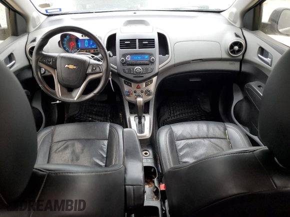 2012 Chevrolet Sonic LTZ z VIN 1G1JE5SB2C4173638, wystawiony jako Copart lot #84634474 z przebiegiem 148 247 mil mil oraz Szkoda całkowita • Salvage title. Historia ofert i sprzedaży dostępna na DreamBid. Obrazek 8.