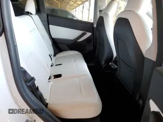 2022 Tesla Model Y Performance z VIN 7SAYGDEF0NF337959, wystawiony jako Copart lot #56871985 z przebiegiem 54 527 mil mil oraz Szkoda całkowita • Salvage title. Historia ofert i sprzedaży dostępna na DreamBid. Obrazek 10.