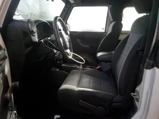 2011 Jeep Wrangler Sport with VIN 1J4AA2D12BL555530, listed as a Copart auction lot 42049915 with 83,349 mi miles and Salvage Title. Bid and sale history available at carsss.com. Image 7.