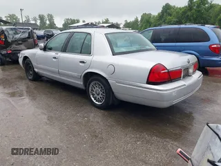 2001 Mercury Grand Marquis GS z VIN 2MEFM74W91X618246, wystawiony jako IAAI lot #42226130 z przebiegiem 125 487 mil mil oraz . Historia ofert i sprzedaży dostępna na DreamBid. Obrazek 3.