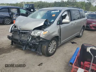 2016 Toyota Sienna XLE with VIN 5TDYK3DC0GS697468, listed as a Copart auction lot 51186795 with 128,851 mi miles and Salvage Title. Bid and sale history available at DreamBid. Image 1.
