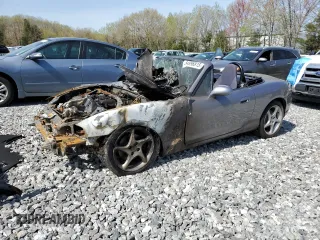 2003 Mazda MX-5 Miata Cloth z VIN JM1NB353630307018, wystawiony jako Copart lot #54896815 z przebiegiem Nie podano mil oraz Czysty tytuł • Clean title. Historia ofert i sprzedaży dostępna na DreamBid. Obrazek 1.