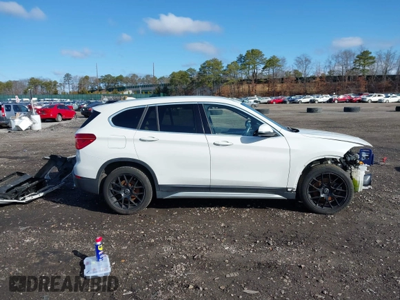 2018 BMW X1 xDrive28i with VIN WBXHT3C34J5L29714, listed as a IAAI auction lot 41825126 with 89,970 mi miles. Bid and sale history available at carsss.com. Image 13.