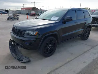 2018 Jeep Grand Cherokee Altitude with VIN 1C4RJFAG9JC436848, listed as a IAAI auction lot 42303459 with 124,044 mi miles and . Bid and sale history available at DreamBid. Image 17.