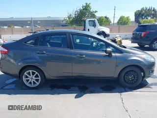 2019 Ford Fiesta SE z VIN 3FADP4BJ2KM131012, wystawiony jako IAAI lot #42228822 z przebiegiem 100 460 mil mil oraz . Historia ofert i sprzedaży dostępna na DreamBid. Obrazek 13.