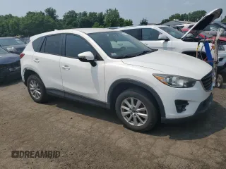 2016 Mazda CX-5 Touring z VIN JM3KE4CY1G0820270, wystawiony jako Copart lot #59664535 z przebiegiem 129 709 mil mil oraz Czysty tytuł • Clean title. Historia ofert i sprzedaży dostępna na DreamBid. Obrazek 4.