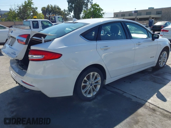 2019 Ford Fusion Hybrid SE with VIN 3FA6P0LU9KR207824, listed as a IAAI auction lot 42153330 with 69,966 mi miles. Bid and sale history available at carsss.com. Image 4.