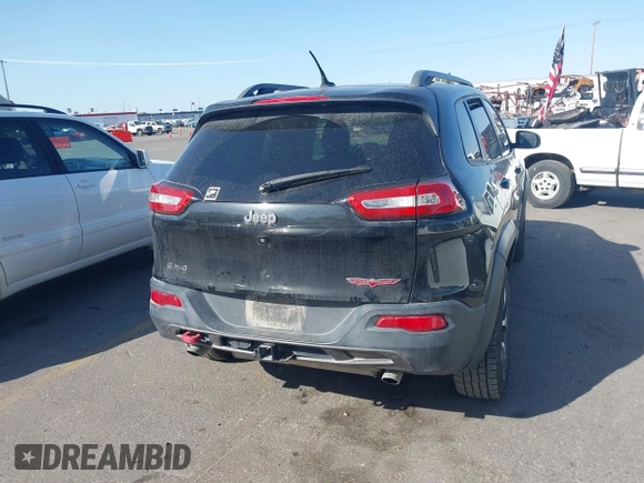 2015 Jeep Cherokee Trailhawk with VIN 1C4PJMBS4FW556822, listed as a IAAI auction lot 42412874 with 129,865 mi miles and . Bid and sale history available at DreamBid. Image 16.