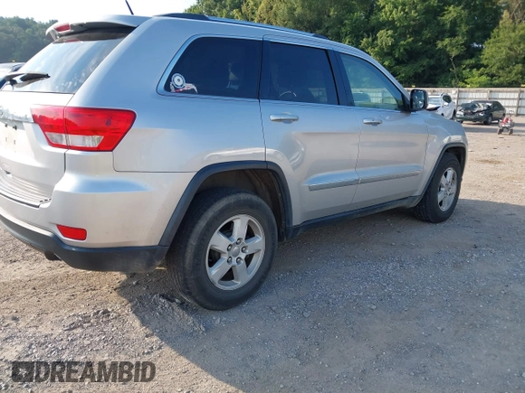 2011 Jeep Grand Cherokee Laredo with VIN 1J4RR4GG2BC514497, listed as a IAAI auction lot 42688206 with 88,822 mi miles and . Bid and sale history available at DreamBid. Image 4.