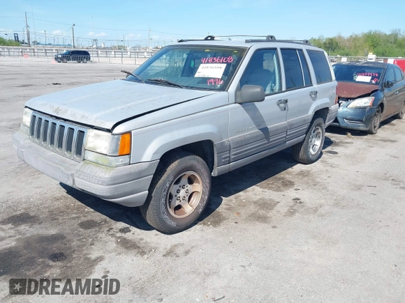 1996 Jeep Grand Cherokee Laredo with VIN 1J4FX58S2TC397006, listed as a IAAI auction lot 41836108 with 136,742 mi miles. Bid and sale history available at carsss.com. Image 2.