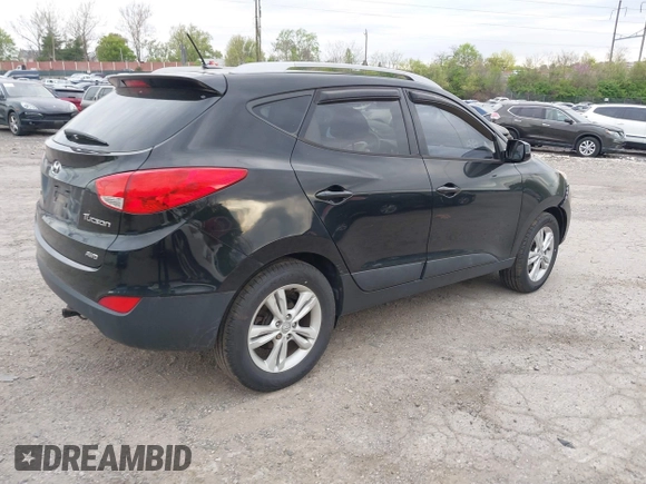 2011 Hyundai Tucson Limited with VIN KM8JUCACXBU293660, listed as a IAAI auction lot 42051931 with 99,995 mi miles and . Bid and sale history available at DreamBid. Image 4.