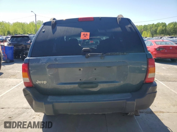 2004 Jeep Grand Cherokee Laredo with VIN 1J4GX48S74C195326, listed as a Copart auction lot 53993785 with 280,456 mi miles and Salvage title. Bid and sale history available at DreamBid. Image 6.