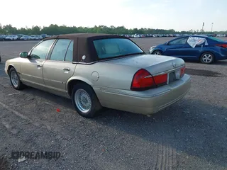 1999 Mercury Grand Marquis LS z VIN 2MEFM75W1XX703878, wystawiony jako IAAI lot #42074187 z przebiegiem 56 962 mil mil oraz . Historia ofert i sprzedaży dostępna na DreamBid. Obrazek 3.