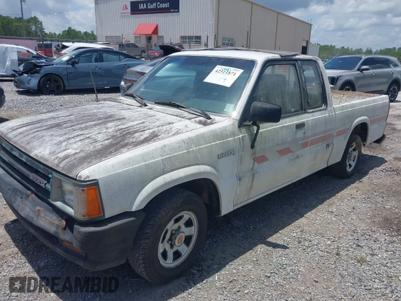 1991 Mazda B-Series Truck z VIN JM2UF3133M0169084, wystawiony jako IAAI lot #42511871 z przebiegiem 175 426 mil mil oraz . Historia ofert i sprzedaży dostępna na DreamBid. Obrazek 6.