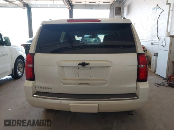 2015 Chevrolet Tahoe LTZ with VIN 1GNSKCKC9FR123996, listed as a IAAI auction lot 42113435 with 149,825 mi miles and . Bid and sale history available at DreamBid. Image 16.