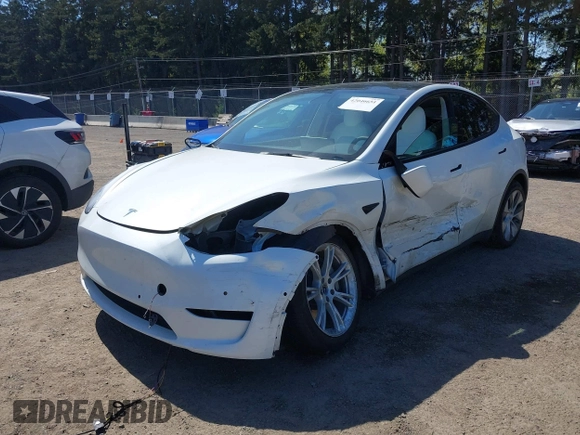 2022 Tesla Model Y Long Range z VIN 7SAYGDEE7NF418223, wystawiony jako IAAI lot #42046651 z przebiegiem 18 724 mil mil oraz . Historia ofert i sprzedaży dostępna na DreamBid. Obrazek 2.