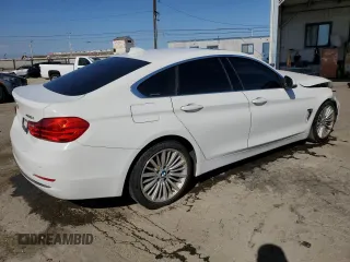 2015 BMW 4 Series 428i with VIN WBA4A9C58FGL85220, listed as a Copart auction lot 57128265 with 115,257 mi miles and Salvage title. Bid and sale history available at DreamBid. Image 3.
