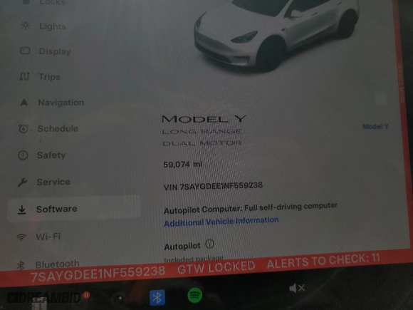 2022 Tesla Model Y Long Range with VIN 7SAYGDEE1NF559238, listed as a Copart auction lot 86744664 with 59,074 mi miles and Salvage Title. Bid and sale history available at carsss.com. Image 9.