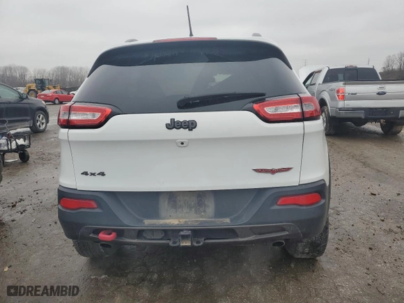 2015 Jeep Cherokee Trailhawk with VIN 1C4PJMBS9FW698857, listed as a Copart auction lot 86572504 with 143,919 mi miles and Clean Title. Bid and sale history available at carsss.com. Image 6.