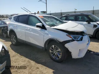 2016 Toyota RAV4 Hybrid XLE with VIN JTMRJREV2GD058966, listed as a Copart auction lot 58908824 with 0 mi miles and Salvage Title. Bid and sale history available at carsss.com. Image 4.