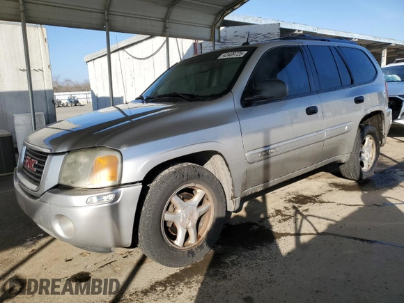2005 GMC Envoy SLE with VIN 1GKDS13S852374516, listed as a Copart auction lot 42409725 with 299,816 mi miles and Salvage Title. Bid and sale history available at carsss.com. Image 1.
