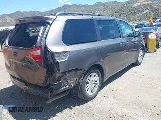 2016 Toyota Sienna XLE with VIN 5TDYK3DCXGS722960, listed as a IAAI auction lot 42153794 with 147,331 mi miles. Bid and sale history available at carsss.com. Image 4.