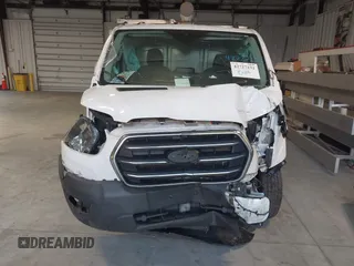 2020 Ford Transit Cargo with VIN 1FTBR1Y81LKA19650, listed as a IAAI auction lot 42727232 with 103,676 mi miles and . Bid and sale history available at DreamBid. Image 12.