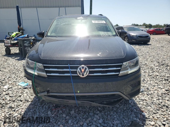 2021 Volkswagen Tiguan S z VIN 3VV1B7AX2MM020872, wystawiony jako Copart lot #57106925 z przebiegiem 92 908 mil mil oraz Czysty tytuł • Clean title. Historia ofert i sprzedaży dostępna na DreamBid. Obrazek 5.