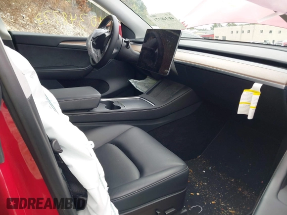2023 Tesla Model Y Long Range with VIN 7SAYGAEE5PF685474, listed as a IAAI auction lot 40348773 with 26,605 mi miles and . Bid and sale history available at DreamBid. Image 5.