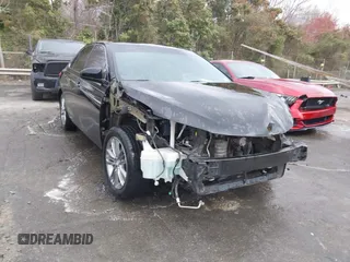2015 Toyota Camry XLE with VIN 4T1BF1FK9FU114582, listed as a IAAI auction lot 41801187 with 165,199 mi miles. Bid and sale history available at carsss.com. Image 1.