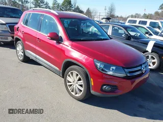 2014 Volkswagen Tiguan SEL with VIN WVGAV3AX9EW113402, listed as a IAAI auction lot 41279412 with 118,857 mi miles and . Bid and sale history available at DreamBid. Image 1.